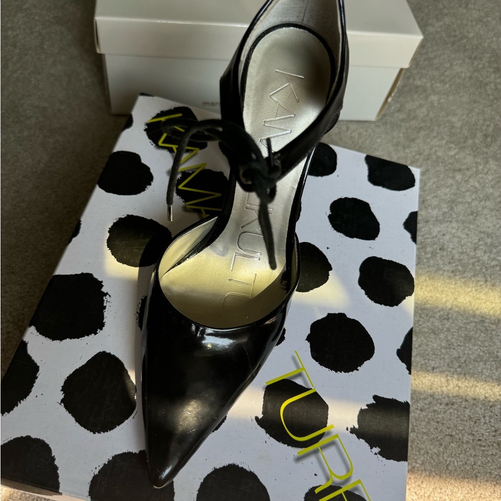 Black patent pumps by Norma Kamala